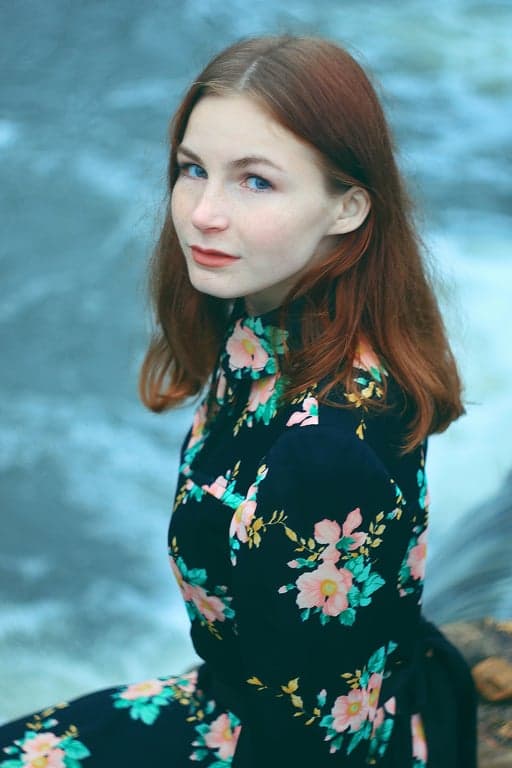 a portrait of a person transformed into a random cartoon character with simplified facial geometry, expressive cartoon features, clean line art, flat color fills, and a unique character identity