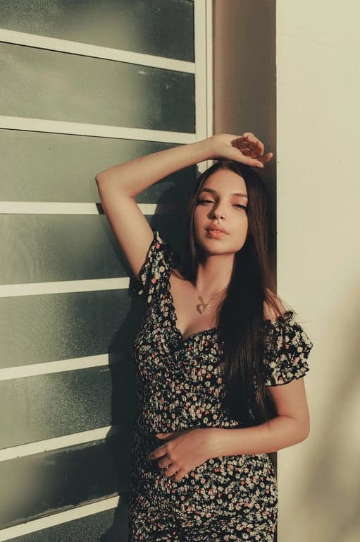 a portrait of a person reimagined in a classic American Gothic realism style with carefully structured facial planes, calm but intense expression, balanced symmetrical framing, subdued lighting, restrained color usage, and a solemn American rural mood