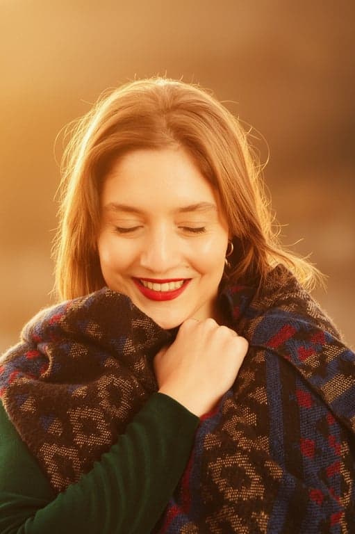 a portrait of a person styled with a cinematic golden hour atmosphere, featuring warm tones, gentle bloom, and preserved image detail