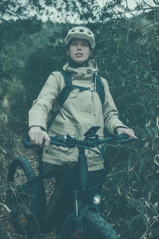 a portrait of a person transformed with an 1980s analog film fade, characterized by muted green and blue tones, low contrast, and a hazy glow