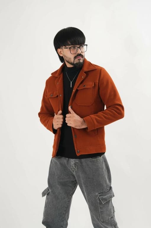 a portrait of a man edited in a Korean two-block men hairstyle style, so that the top hair is medium length and straight and visibly longer than the sides, with the fringe extending over the forehead in a typical Korean haircut silhouette, sides and back cut much shorter, no curls or waves, and unchanged face and original lighting