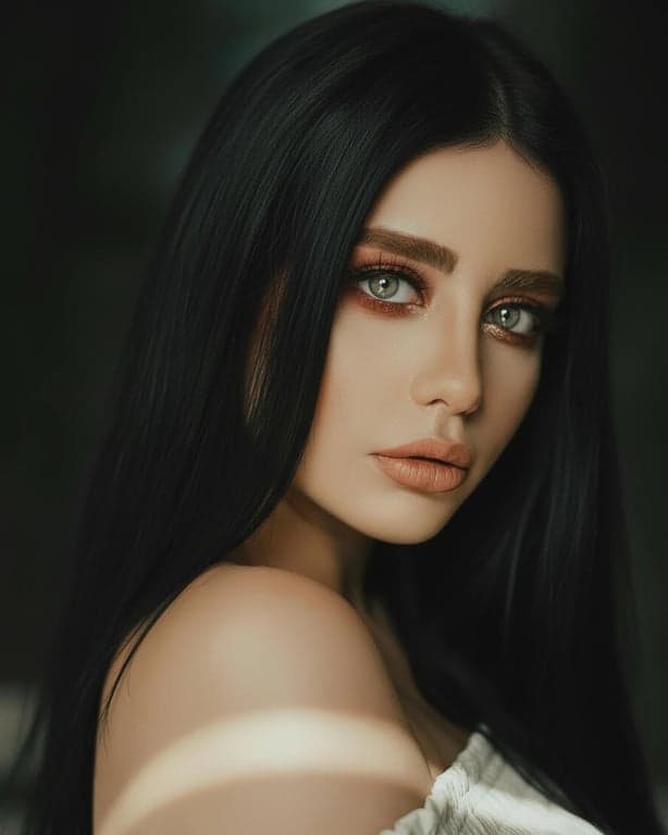 a portrait of a person styled with deep black hair, showing controlled darkness, soft reflective highlights, preserved volume, and realistic scalp transitions