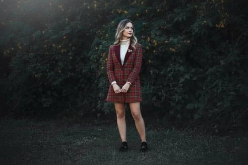 Christmas outfit after – person wearing a tartan skirt set with holiday accessories