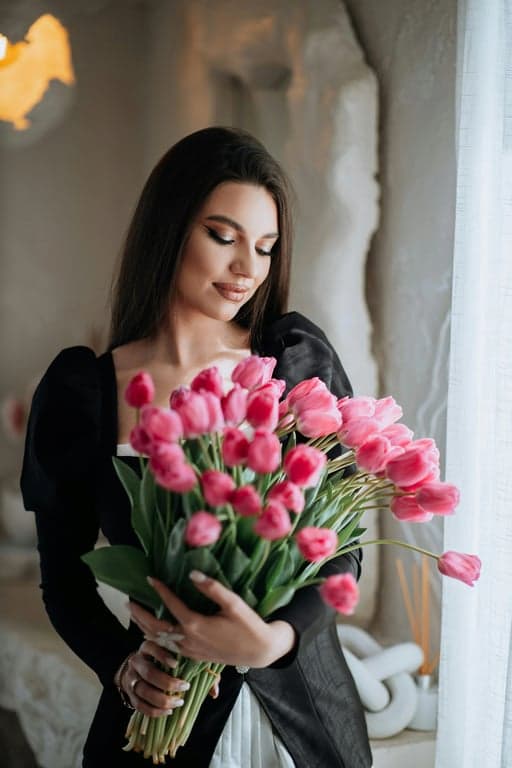 a portrait of a person edited for a cleaner jawline silhouette by reshaping the visual contour of the lower face, emphasizing straightness along the jaw and a firmer jaw corner; add depth under the chin to separate face from neck more decisively; avoid geometry warping; maintain natural neck proportions and skin texture; background unchanged; the facial outline should appear sharper and more confident