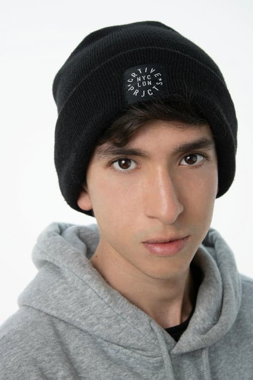 a portrait of a person converted into an anime hero illustration with My Hero Academia vibes, featuring dynamic lighting, bold graphic shapes, simplified textures, and energetic character design