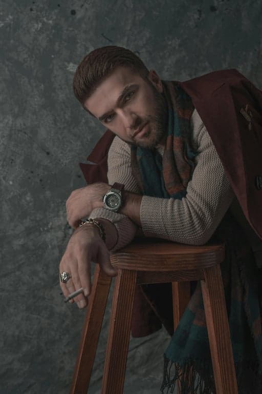 a portrait of a man, golden hour filter effect, long shadows, warm highlights, hazy sunlight, peaceful atmosphere.