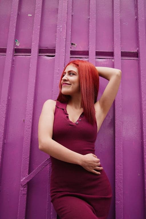 a portrait of a woman, soft light filter effect, dreamy glow, reduced contrast, pastel color tones, natural light background.