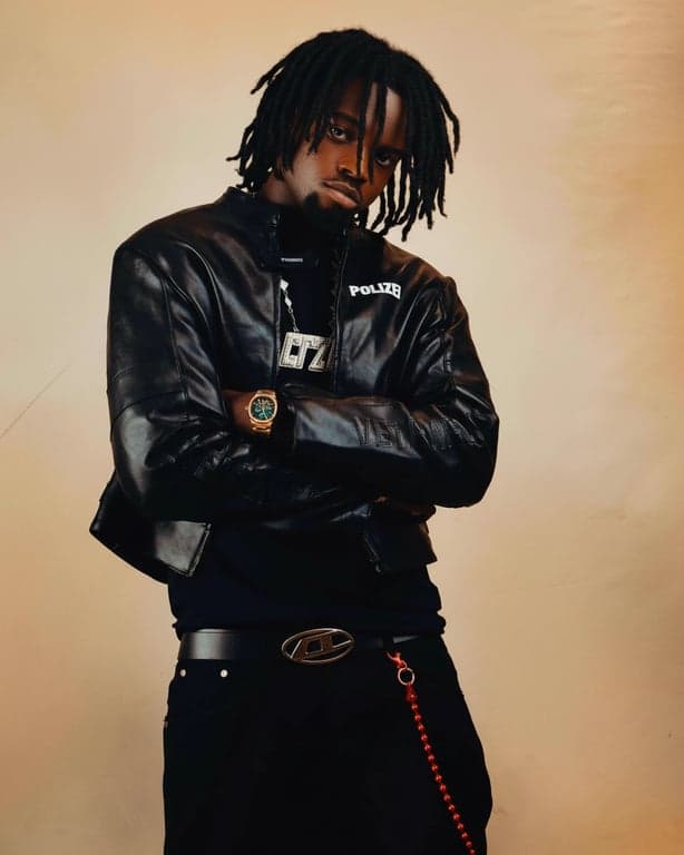 a portrait of a person edited to significantly lower the hairline, moving it clearly downward across the forehead so the forehead appears visibly smaller and the hair looks much fuller; the new hairline should be obvious at first glance