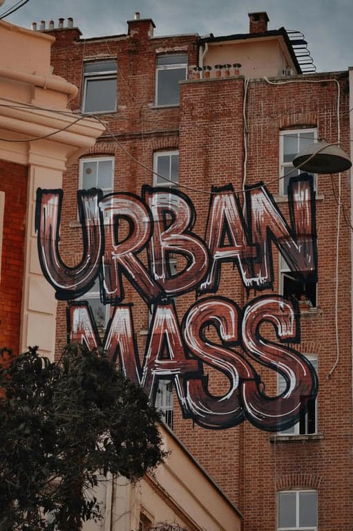 Create graffiti as a deliberate authored act, as if a specific artist is expressing identity and attitude through letterform choices. Focus on intentional stroke decisions, confident execution, and personal style, allowing imperfections, asymmetry, and variation to signal authorship rather than generic street decoration.