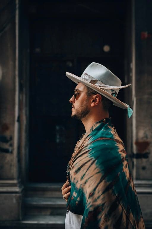 a portrait of a person transformed into a classic spider hero, wearing a red-and-blue spider suit with web patterns and chest emblem, full mask with expressive white eye lenses, dynamic upright pose, clean comic-style lighting, and a heroic confident mood