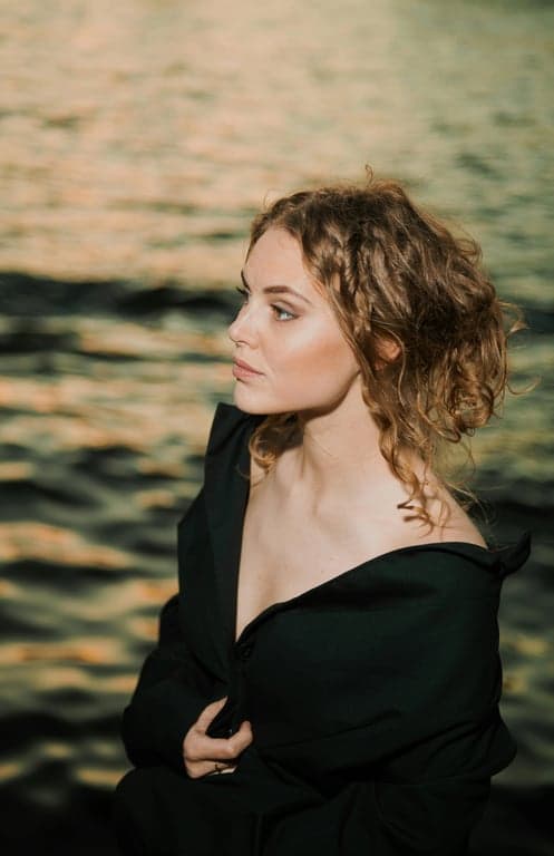 a portrait of a person edited with instant camera aesthetics, including muted saturation, lifted shadows, mild highlight bloom, and a calm nostalgic feel