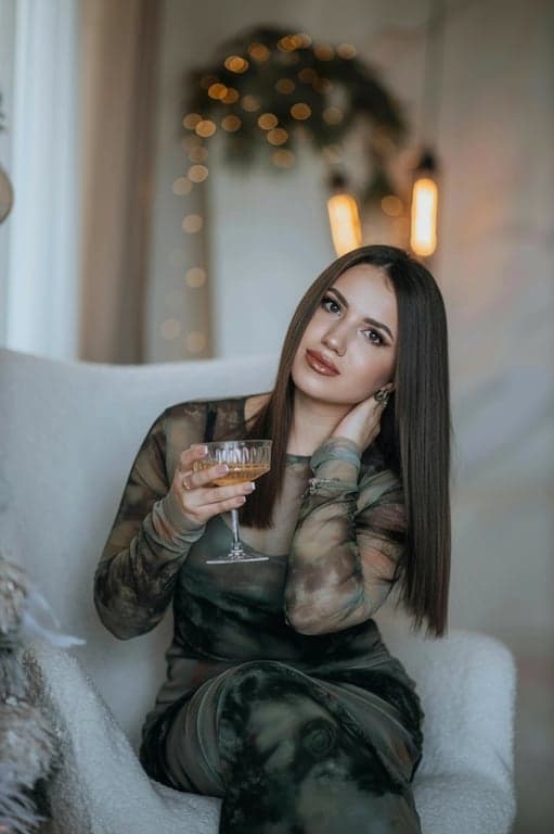 a portrait of a person refined to appear more sculpted in the lower face by carving out a clearer jaw silhouette, reducing visual roundness near the jaw corners; reinforce the mandibular line so the face reads more angular and structured; maintain natural bone structure; preserve skin grain and lighting direction; no background modification; the face shape should look intentionally stronger and more defined