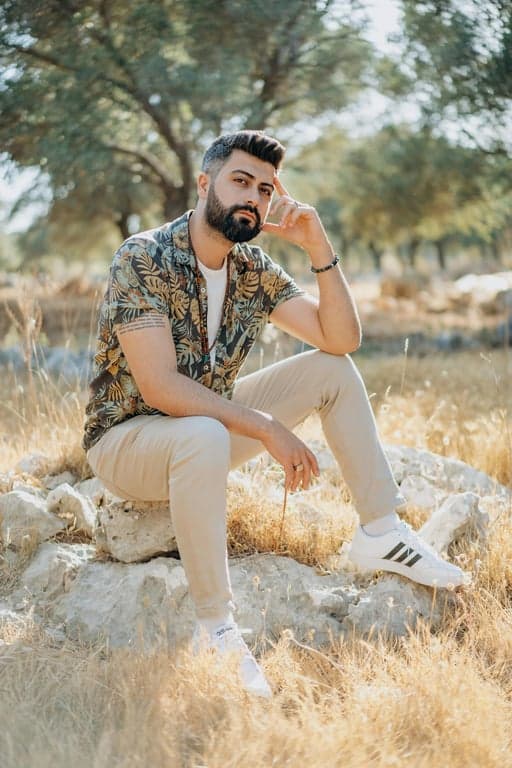 a portrait of a person recreated in a Marvel Comics graphic illustration style with clean black inking, stylized anatomy, dramatic contrast, and classic superhero tone