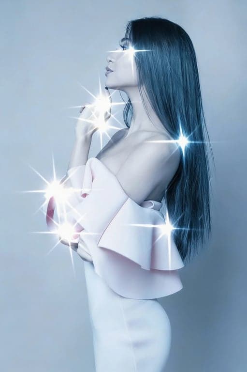 A futuristic cool filter on a portrait of a woman, cyan and magenta split-toning, glossy skin effect, geometric shadows, sleek and modern vibe.