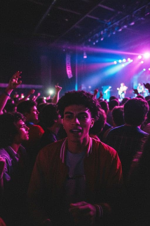 a portrait of a man at a concert, 80s concert photo style, high contrast, strong grain, dynamic flash lighting, dark shadows, vibrant colors.