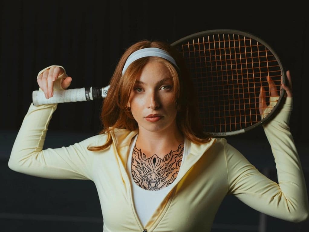 anime tattoo after photo - woman wearing yellow coat with anime tattoo