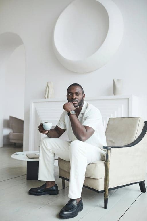 a portrait of a person rendered in a traditional American Gothic painting style featuring precise facial realism, stiff upright posture, muted natural colors, flat even lighting, minimal dramatization, and a distinctly American early-20th-century rural aesthetic