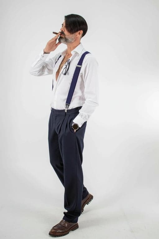 a portrait of a man edited in a Korean salon men hairstyle style, so that the top hair is medium length and straight, clearly parted to one side from the front hairline as commonly seen in Korean side-part haircuts, with the fringe falling diagonally across the forehead, sides and back trimmed short and straight, no curls or waves, and unchanged face and original lighting