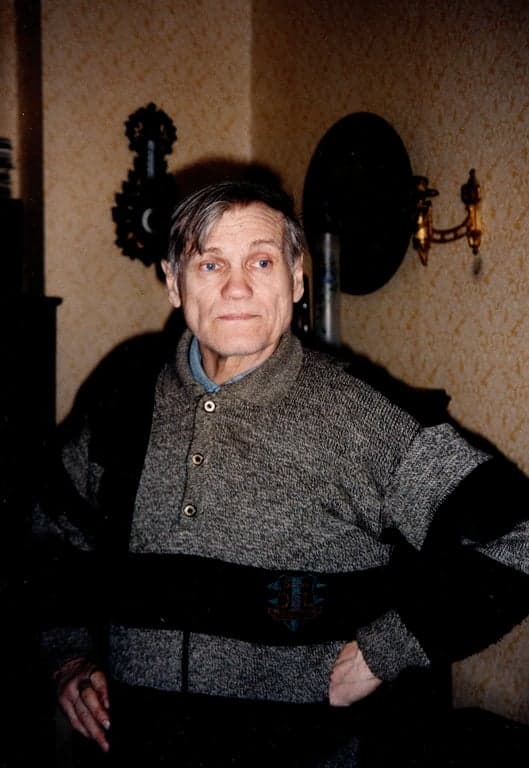 a portrait of a person wearing a horror movie villain cosplay, with iconic mask, costume, and eerie lighting to capture the character's essence