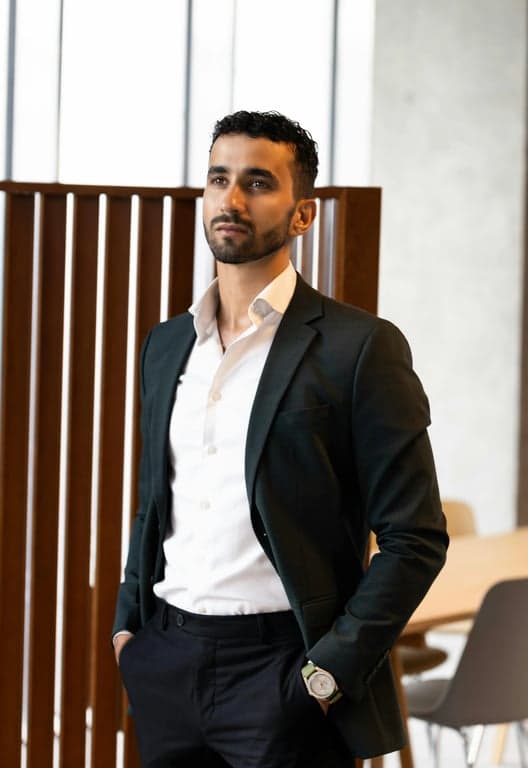 an original character in family guy style, exaggerated features (large head, tiny body), simple clothing design, standing in a living room setting.