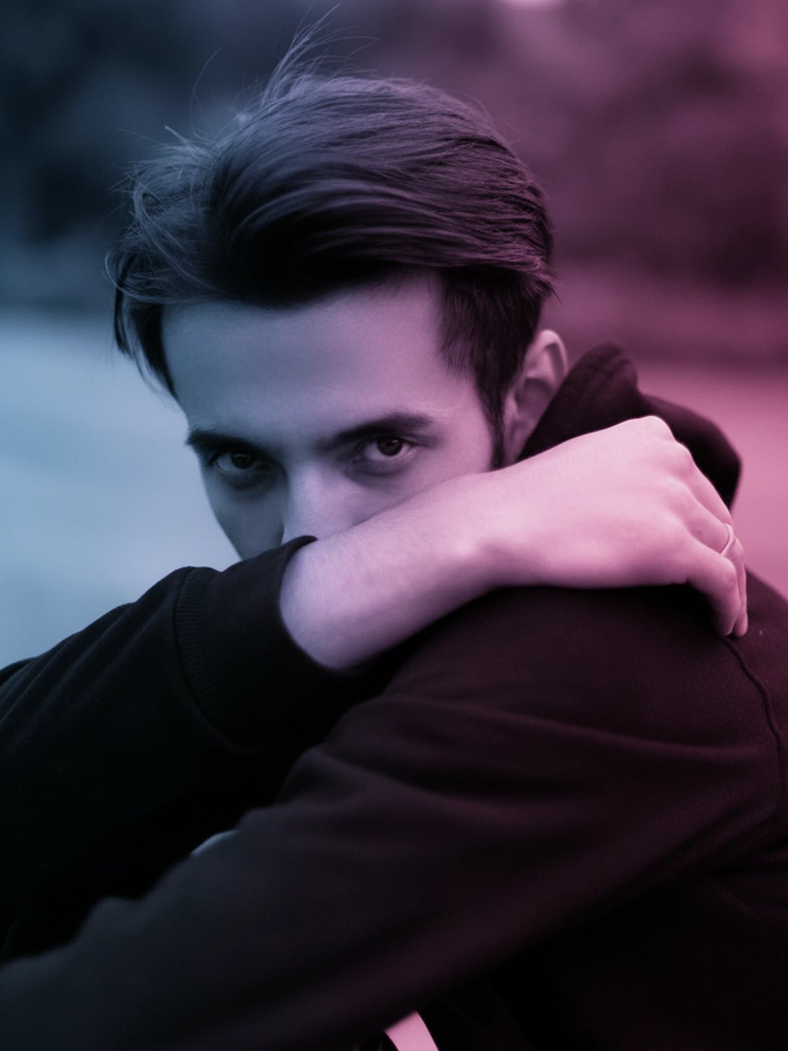 AI edited portrait with cinematic neon lighting in blue and purple, creating a Cyberpunk vibe.