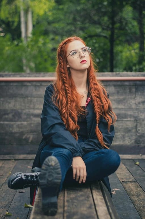 create a braided look that integrates soft waves or curls, ensuring that the braids don’t feel overly tight or stiff but flow naturally with the rest of the hair