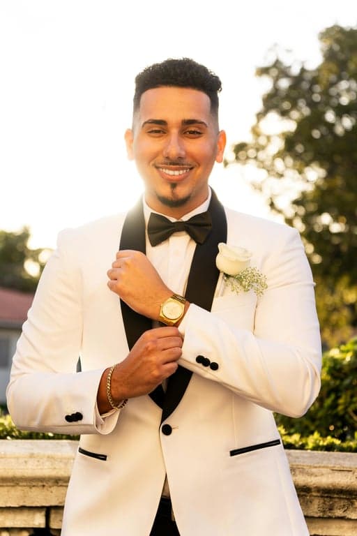 Transform the original person into a human-style character within the Hello Kitty parallel world while preserving hairstyle, pose, and outfit silhouette. Simplify the face into minimal cartoon features and place Hello Kitty standing next to the character as a clear world anchor, both rendered in the same flat 2D animation style with oversized heads, tiny bodies, pastel colors, and thick outlines.