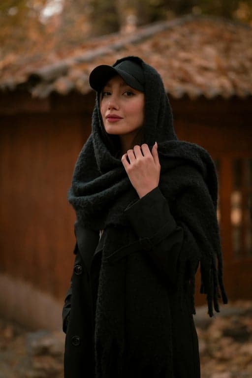 a portrait of a person with jawline refinement achieved through face-shape–aware contour enhancement, not geometry warping; reduce roundness in the lower face by sharpening the jaw edge and increasing contrast along the mandibular line; create a clearer break between jaw and neck to visually shorten the lower-face softness zone; keep cheeks, jaw width, and chin length consistent; preserve skin gradients and pores; maintain original background and lighting logic; the facial silhouette must look clearly more defined