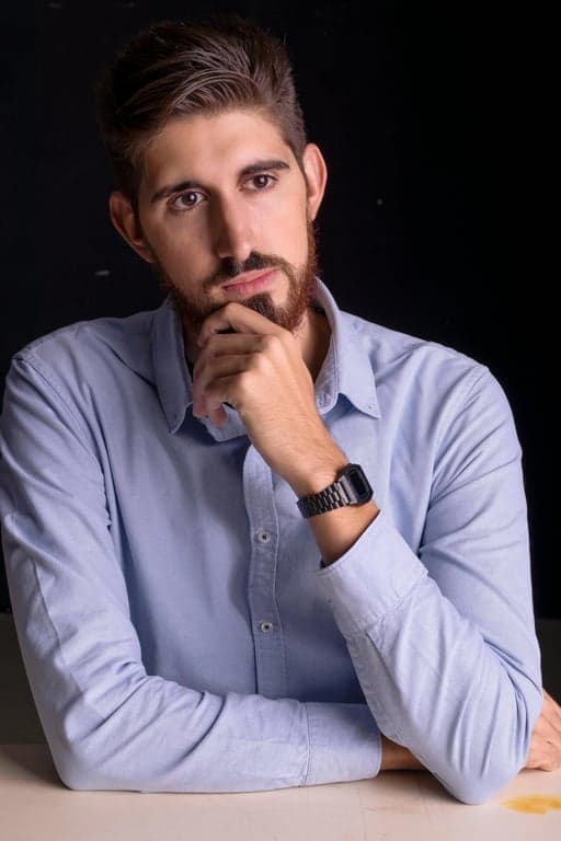 a portrait of a person transformed into an authentic Scooby-Doo cartoon character using classic Hanna-Barbera character design rules, featuring an oversized rounded head, narrow sloping shoulders, long simplified neck, wide-set oval eyes with black pupils, thick arched eyebrows, a rounded nose, simple curved mouth, flat pastel color fills, thick black outlines, minimal cel shading, and a clearly recognizable Scooby-Doo animation look