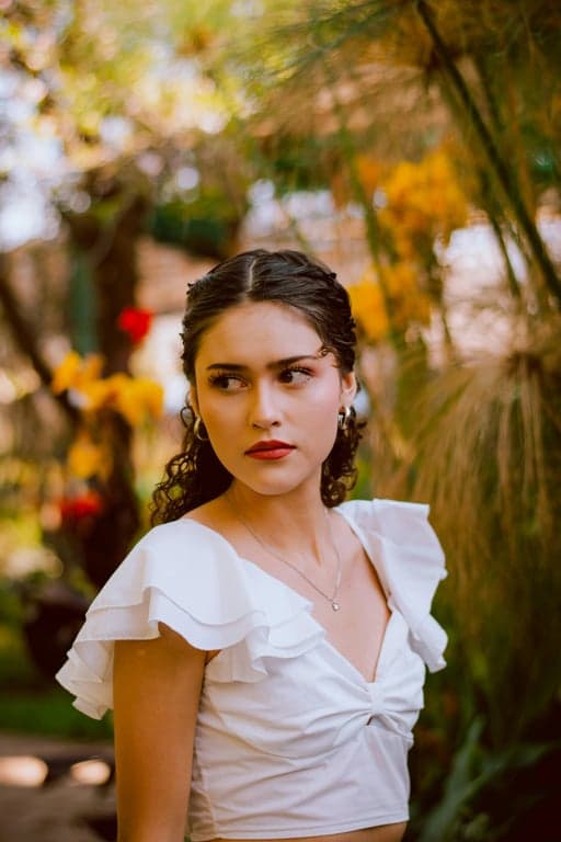 a portrait of a person styled with retro camera visuals, showing yellowed highlights, slightly green or blue color cast, grainy texture, and low dynamic range