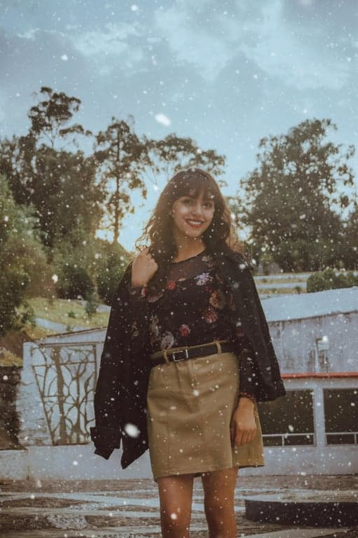 a cinematic snow effect that enhances the original photo with large foreground snowflakes, drifting midground particles, dramatic lighting interaction, and high contrast to create a film-like winter scene