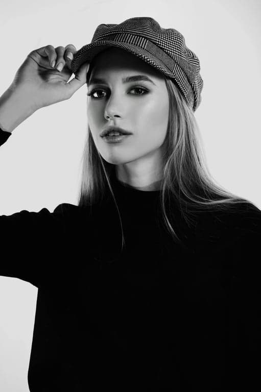 A black and white portrait with a crying effect, where the tears are the brightest part of the image, high contrast, timeless and emotional feel.