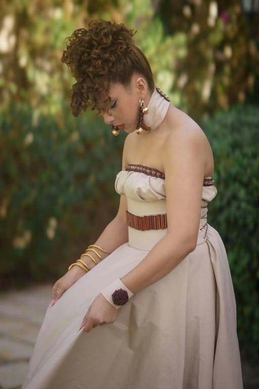 A portrait of a person reinterpreted as a fully non-human My Little Pony pony, standing naturally on all four hooves, viewed from a classic side or three-quarter side angle, explicitly excluding any humanoid body structure or bipedal stance, translating original facial traits into eye emotion only, converting hairstyle into a stylized flowing mane, keeping the original background and scene composition intact, using authentic pony anatomy and a symbolic cutie mark.