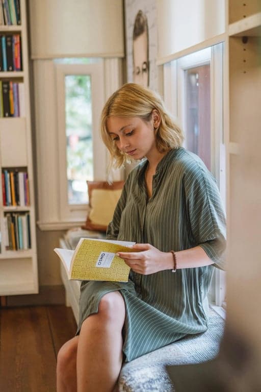 a portrait of a person redesigned as an Adventure Time-style cartoon figure with rubber-hose limbs, rounded abstract body shapes, tiny dot eyes, minimal expression, bold uneven outlines, flat bright colors, and a playful hand-drawn animation look.