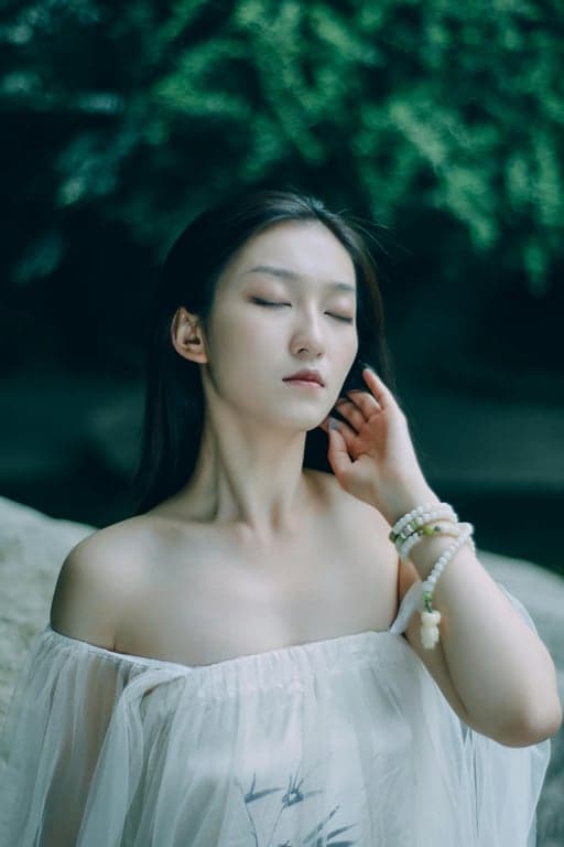 a portrait of a woman, crying filter effect, single realistic tear rolling down cheek, reddened eyes, pouting expression, soft lighting.