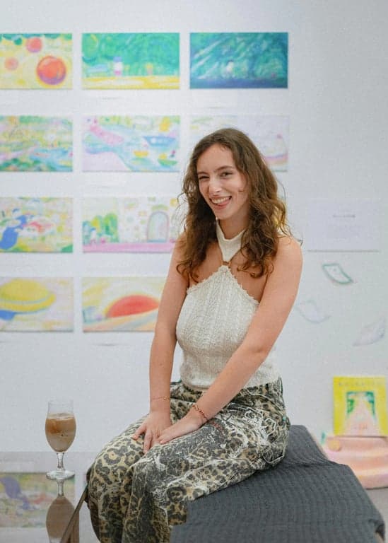 a portrait of a person in a slightly more dressed-up setting, like a nice dinner, with soft lighting and a sophisticated smile