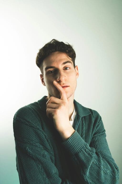 a portrait of a person adapted into a modern Japanese illustration aesthetic with soft color blocking, minimal shading, clean contours, and contemporary design clarity