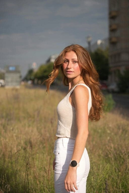 a portrait of a person recreated in a DC Comics graphic novel style with bold contour lines, deep shadows, sculpted highlights, and a dark heroic atmosphere