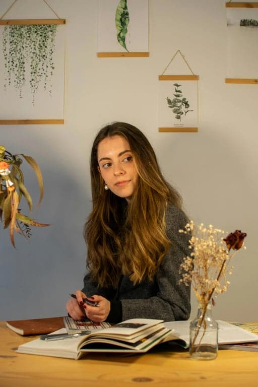 a portrait of a person illustrated in a surreal cartoon animation style inspired by Adventure Time, intentionally removing realism, using awkward proportions, noodle arms, simplified facial features, flat colors, and a whimsical absurd tone.