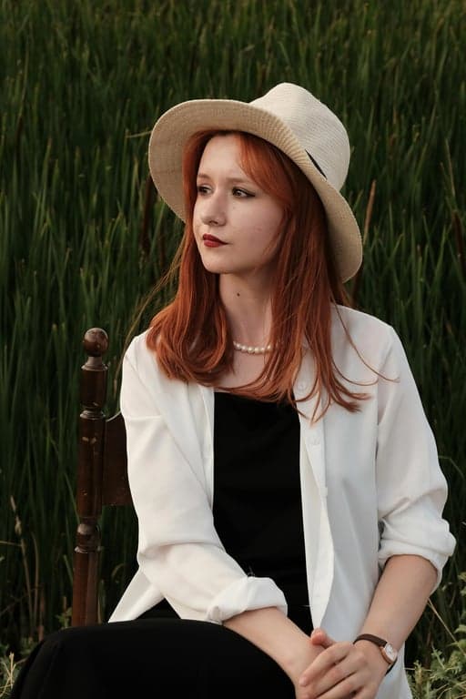 a portrait of a person edited to have metallic silver hair, balancing light gray and cool undertones, maintaining depth, realistic root shading, and smooth highlight transitions