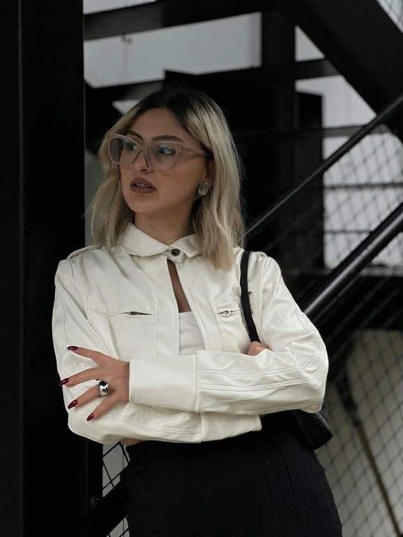 a portrait of a person transformed into a pop art filter style featuring thick black outlines, simplified facial features, flat saturated color blocks, strong contrast, minimal shading, and a bold graphic pop art poster look