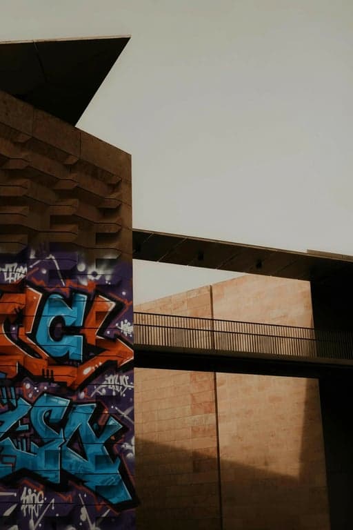 Generate graffiti as if a single artist is quickly tagging a wall in one uninterrupted motion. Focus on instinctive letter construction, hand-driven rhythm, uneven speed, and pressure changes, allowing letters to stretch, compress, and tilt naturally to express attitude, confidence, and personal identity rather than symmetry or polish.