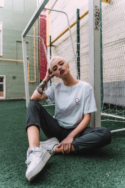 a portrait of a woman edited with a Lomography-style film grain, featuring vibrant colors, vignetting, and chunky grain texture