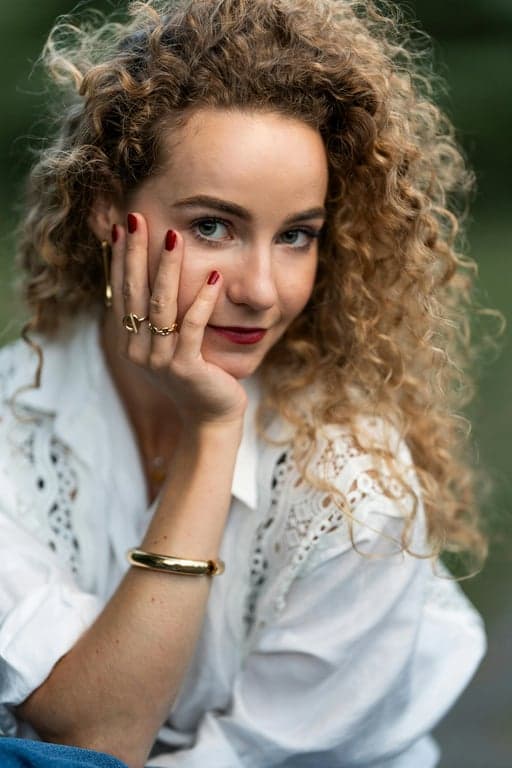 a portrait of a person recolored with pastel pink hair, preserving hair flow, strand separation, and natural shadow depth