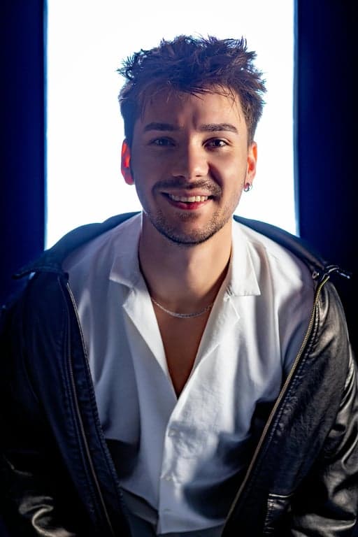 a portrait of a person as a member of the Revolutionary Army, wearing a cloak and hood with a mysterious ambiance