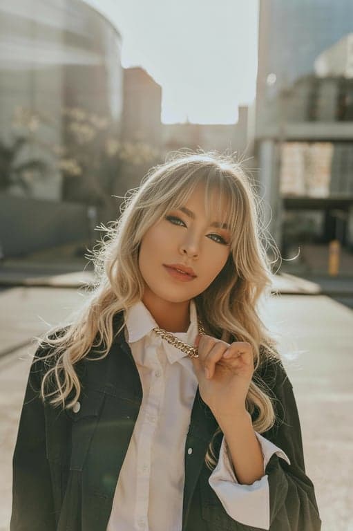 generate a high-quality fringe hair filter result that prioritizes realism, face adaptation, and seamless integration over stylization