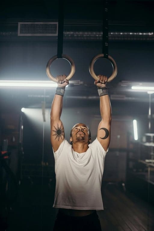 ai tattoo generator after pic - man using round hanging ring with tattoo