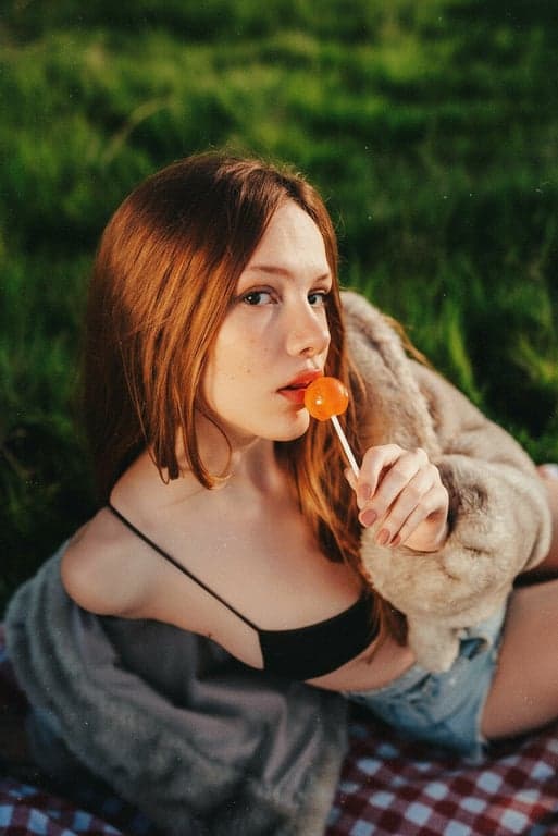 A dynamic action shot treated with a fast-film grain effect, high contrast, and color saturation reminiscent of 80s sports or action photography.